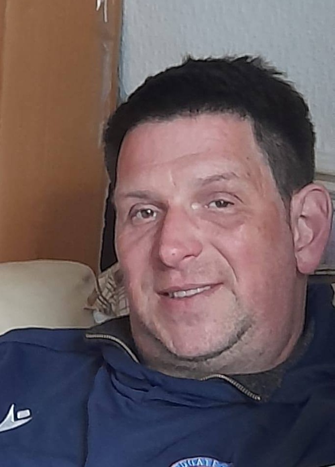 The owner of Walk and Wag wearing a club top